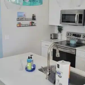 g1Kmen_l-AC - Mister Moppin - Mister Moppin Bright Panama City Beach vacation rental kitchen prepared for incoming guests